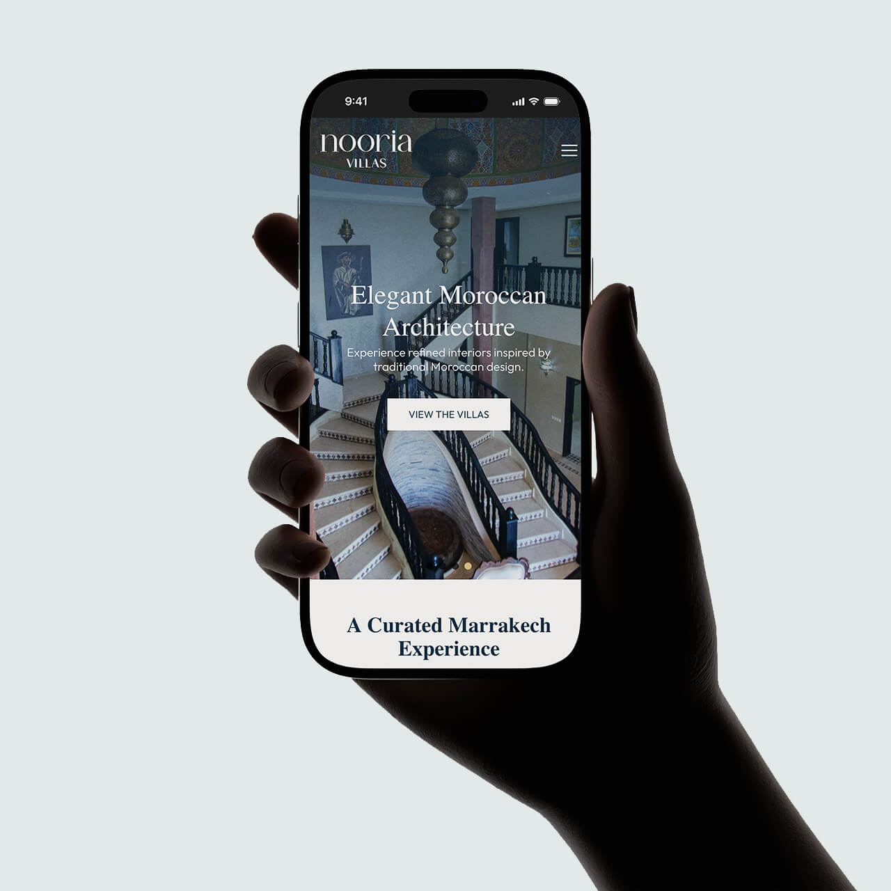 Nooria Villas mobile website showing the Elegant Moroccan Architecture slide with a View the Villas button