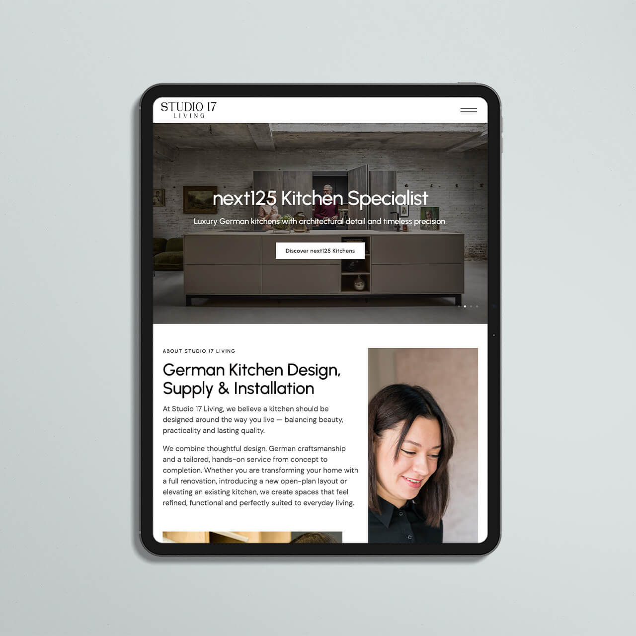 Studio 17 Living website on a tablet showing the next125 Kitchen Specialist slide and kitchen design section